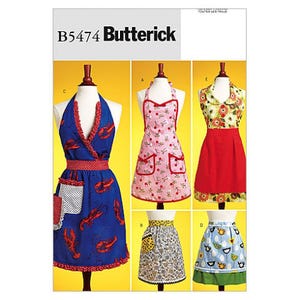 Puede incluir: Sobre de patrón de costura Butterick B5474 con cinco diseños de delantales. Los estilos incluyen un delantal azul con estampado de langostas, uno rosa con cerezas, uno floral con falda roja, un medio delantal estampado y uno azul con motivos de aves.