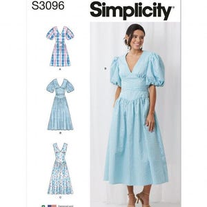 May include: Simplicity sewing pattern S3096 featuring a light blue dress with a V-neckline, puff sleeves, and a fitted waist. The pattern includes three variations: a plaid design, a solid light blue version, and a floral print option.