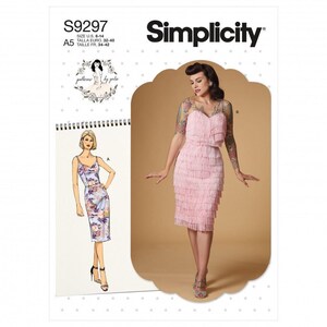 May include: Simplicity sewing pattern S9297 featuring a sleeveless, knee-length dress with tiered fringe detailing. The pattern envelope displays a technical illustration of a floral print dress and a photograph of the finished garment in light pink.