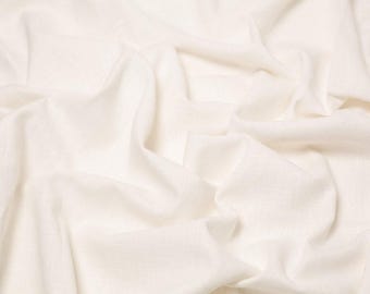 May include: A solid off-white fabric with a visible woven texture, featuring deep folds and soft drapes that create a series of shadows and highlights across the surface, emphasizing the natural movement and soft, matte finish of the textile material.