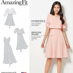 May include: Simplicity 8047 Amazing Fit sewing pattern envelope featuring a light pink knee-length dress with a round neckline, short sleeves, and princess seams. The pattern includes technical line drawings for styles A, B, and C.