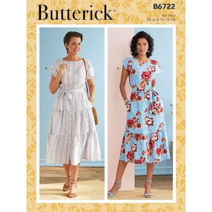 May include: Butterick sewing pattern B6722, size A5 (6-8-10-12-14), features two dress variations. View B is a vertical striped dress with short sleeves and a tie waist. View A is a light blue dress with a red floral print, short sleeves, and a tie waist.