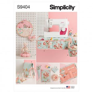 May include: Simplicity pattern S9404 features sewing accessories including a floral hoop organizer, a sewing machine cover, a pincushion, a hanging storage pocket, a needle case, and a fabric tool roll. The items are made from floral fabric.