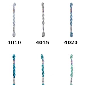 May include: Six skeins of D.M.C. Colour Variation Pearl Thread arranged in two rows. Each skein features a unique blue and green gradient colorway labeled with numbers 4010, 4015, 4020, 4025, 4030, and 4040. The brand logo is at the top.