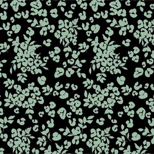 May include: A fabric swatch featuring a black background with a repeating pattern of light sage green floral clusters and abstract leopard-like spots. The design includes a ruler along the top and bottom edges with markings in inches and centimeters.