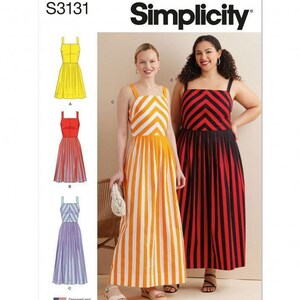 May include: Simplicity sewing pattern S3131 featuring three dress variations. The pattern envelope displays illustrations of a yellow, a red and white, and a purple dress, alongside photographs of two long dresses with chevron bodices and striped skirts.