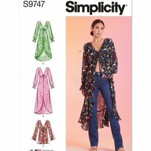 May include: Simplicity sewing pattern S9747 featuring a long-sleeved, V-neck duster with a front tie closure and ruffled hem. The pattern includes three variations: a green floral, a pink patterned, and a short floral version, shown on a model.