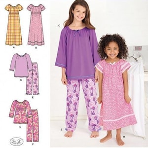 May include: Simplicity 1722 Learn to Sew pattern envelope featuring illustrations and photographs of clothing designs. Includes a purple long-sleeve top with matching cat-print trousers and a pink floral nightgown with white lace trim details.