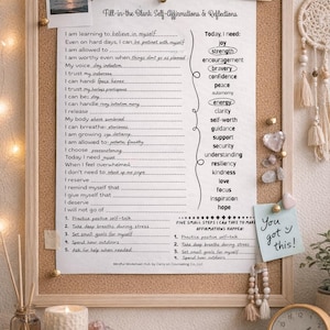 May include: A corkboard with a wooden frame displays a self-affirmation worksheet, a photo, and a handwritten note that says "You got this!". The board is decorated with push pins, a dream catcher, and a small clock.