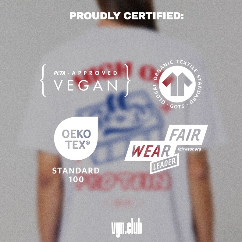 May include: A white t-shirt with various certifications printed on it, including PETA Approved Vegan, Global Organic Textile Standard (GOTS), OEKO-TEX Standard 100, and Fair Wear Leader. The text "vgn.club" is printed on the bottom of the shirt.