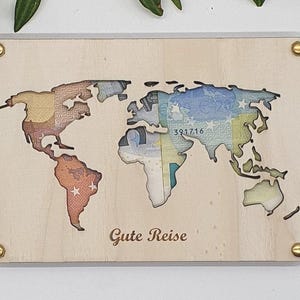 Geldgeschenk Weltkarte mit eingelegtem Geldschein – kreative Geschenkidee