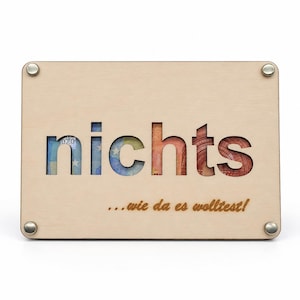 A wooden money gift with the phrase "Nothing... as you wanted it!": a money card with a saying about the election and a greeting.