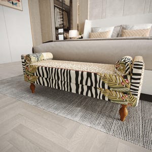 May include: A rectangular upholstered bench featuring a mix of patterns including black and white zebra stripes, a tan leopard print on the seat, and green palm leaf motifs with small red berries on the sides, supported by four wooden legs.