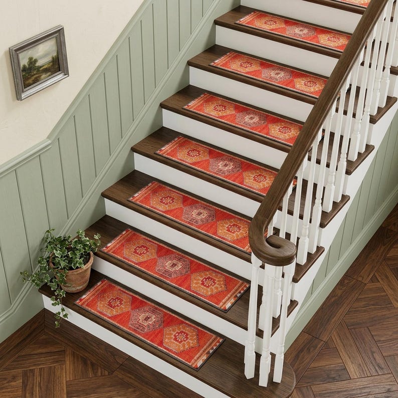 a set of wooden stairs with a white railing, leading up to a higher level. The stairs are adorned with red and orange patterned rugs, and a potted plant is placed on the steps. The overall scene has a warm and inviting atmosphere.