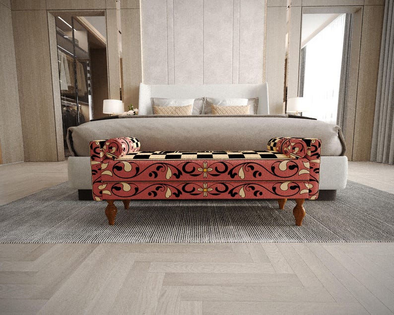 a modern bedroom with a large bed, a red and black patterned bench, and a gray and white rug on the floor.