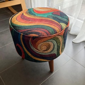 Round Pouf Stool - a unique blend of practicality, sophistication, and timeless patterns. Our pouf stool features a captivating hand-woven rug pattern that is sure to add vibrancy to any home decor.