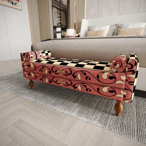a modern bedroom with a large bed and a decorative bench with a checkered pattern on the seat.