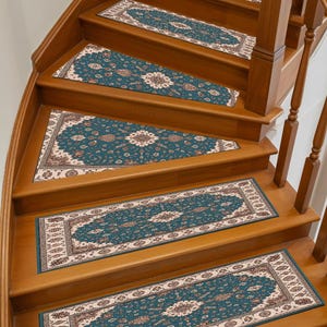 May include: A set of teal and beige stair treads with an ornate, floral pattern. The treads are rectangular and fit snugly on the wooden steps of a curved staircase, enhancing both safety and decor.