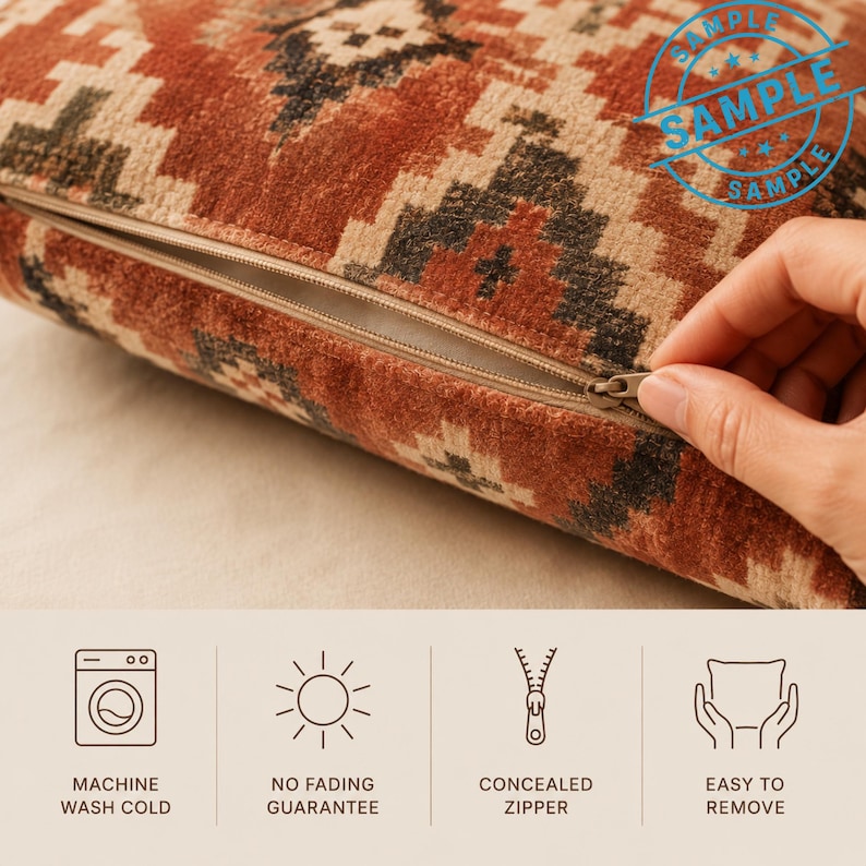 a hand holding a zipper on a pillow with a patterned design. The pillow appears to be machine washable and has a no fading guarantee. The pillow also has a zipper that is concealed, making it easy to remove.