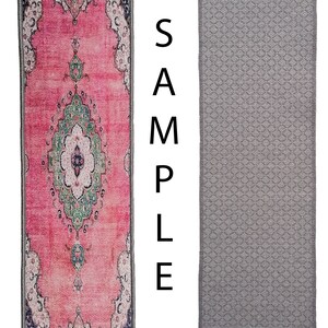 May include: Two doormats, one with a pink and green patterned design and the other with a grey geometric pattern.