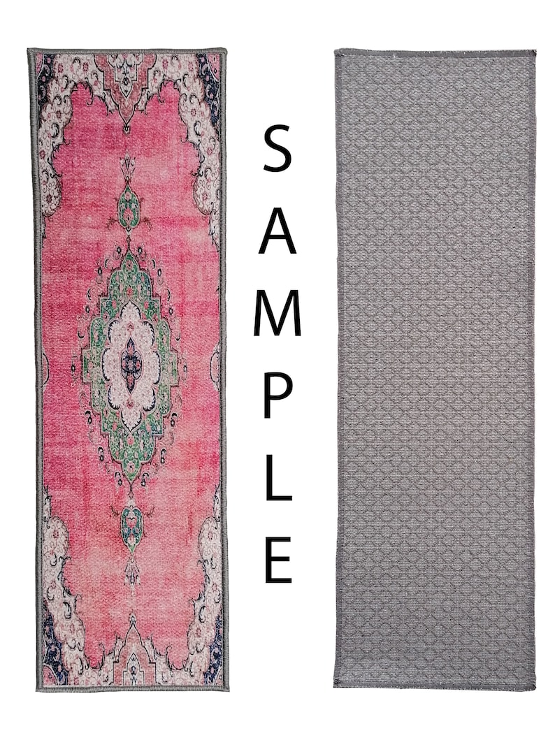 May include: Two doormats, one with a pink and green patterned design and the other with a grey geometric pattern.