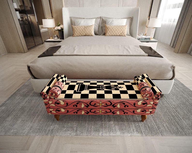 a modern bedroom with a large bed, a checkered bench, and a white headboard. The bed has a gray comforter and a black and white checkered pattern on the bench. The room has a neutral color scheme with gray walls and a gray rug.
