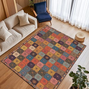 Peut inclure: Un tapis rectangulaire avec un motif floral coloré. Le tapis présente une grille de carrés, chacun contenant une fleur stylisée dans des tons d'orange, de jaune, de bleu, de violet et de rose. Une bordure marron encadre le motif, adapté à un salon.