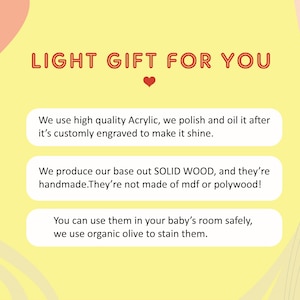 May include: A yellow background with a red heart and text that reads "LIGHT GIFT FOR YOU". Three white boxes with black text describe the product: "We use high quality Acrylic, we polish and oil it after it's customly engraved to make it shine.", "We produce our base out SOLID WOOD, and they're handmade. They're not made of mdf or polywood!" and "You can use them in your baby's room safely, we use organic olive to stain them."