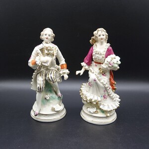 RARE! Antique / Vintage Dresden or most likely Meissen Victorian Couple Figurines. Woman with bouquet of flowers and man holding a letter.