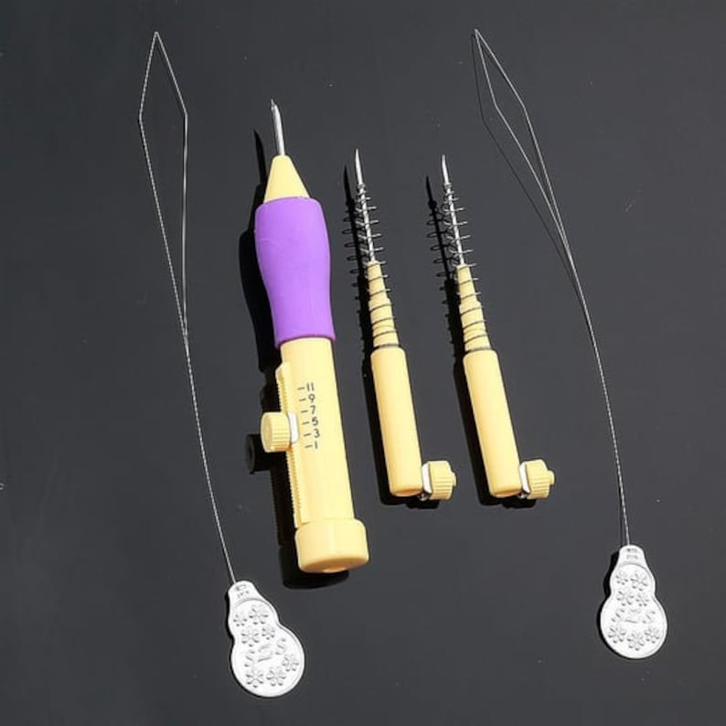 May include: A set of four tools for threading yarn through fabric. The tools are made of plastic and have a purple and yellow color scheme. The tools include a needle threader with a numbered dial, and three separate needle threaders with spring-loaded needles.