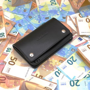 Cartera de piel de tres compartimentos
