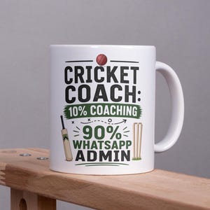 May include: A white ceramic mug featuring a red cricket ball icon and the text CRICKET COACH: 10% COACHING 90% WHATSAPP ADMIN. The design includes a small illustration of a cricket bat and a set of cricket stumps in black, green, and red colours.