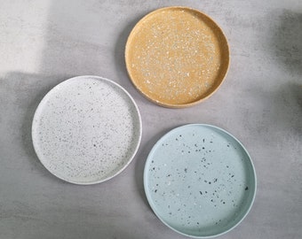 turquoise concrete and black and white terrazzo top