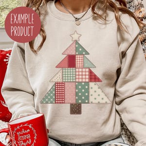 May include: Beige sweatshirt featuring a patchwork Christmas tree design. The tree is composed of various fabric patterns in red, pink, green, and beige, topped with a star. The text "EXAMPLE PRODUCT" is in a red circle.