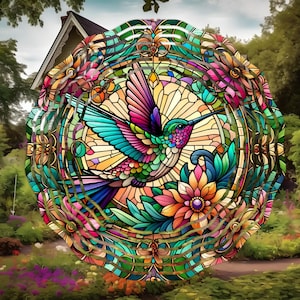 May include: A vibrant stained-glass design featuring a hummingbird with colorful wings and a long beak. The bird is surrounded by floral and leaf patterns in shades of pink, orange, green, and blue. The artwork is circular, with a detailed border and a background of a house and garden.