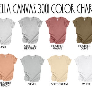 May include: Color chart for Bella Canvas 3001 t-shirts, showing 10 different colors: Ash, Athletic Heather, Heather Mauve, Heather Olive, Heather Peach, Silver, Soft Cream, White, Black, and Navy.