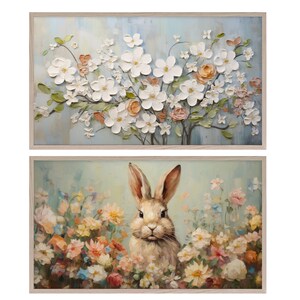Pu&ograve; includere: Due dipinti incorniciati, uno con un bouquet di fiori bianchi su sfondo blu e l'altro con un coniglio marrone in un campo di fiori colorati.