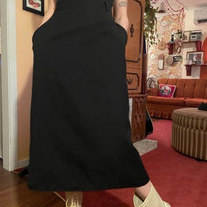 It has pockets--1980s black 100% wool Lindor skirt with belt!