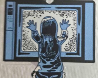 Portacredencial intercambiable Poltergeist. Bueno... ahora sí que estoy llegando a la gente nacida a principios del siglo XX.