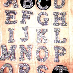 Lavender rhinestone interchangeable letters for initials.  Choose your favorite heavy duty badge reel to pair with your topper