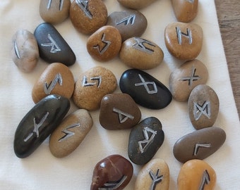 Set of 24 Futhark runes in river pebbles