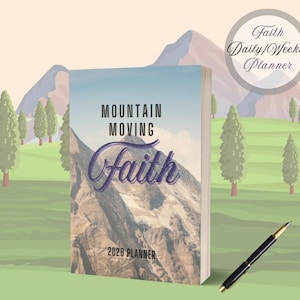 May include: A planner with the words "Mountain Moving Faith" and "2026 Planner" on the cover. The cover features a mountain landscape with a blue sky. A pen rests on the grass next to the planner. A circular graphic reads "Faith Daily/Weekly Planner".