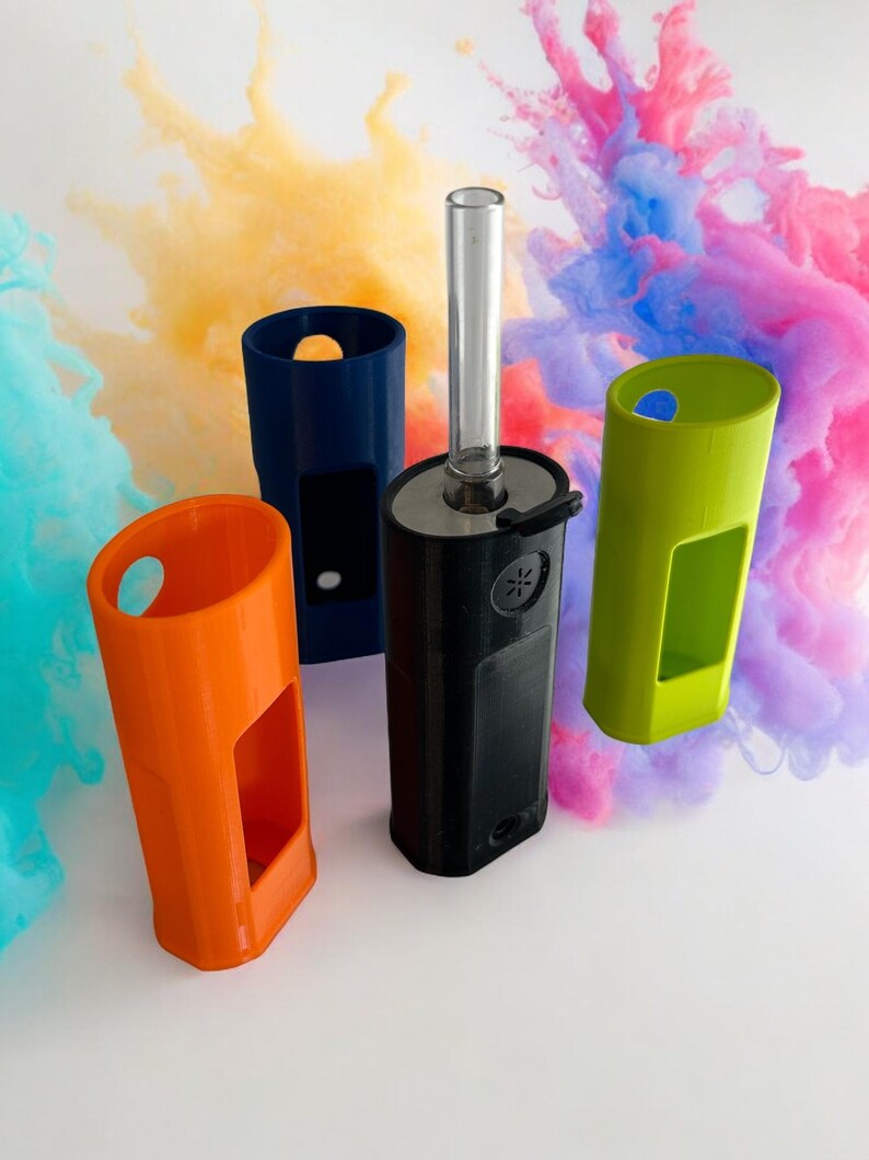 May include: Four different colored plastic cases for a vape device. The cases are orange, blue, green, and black. The black case has a clear glass tube attached to it.