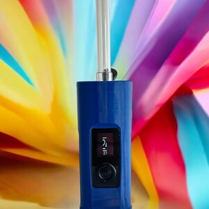 May include: A blue electronic vaporizer with a clear mouthpiece and a digital display showing the temperature set to 214 degrees Fahrenheit.