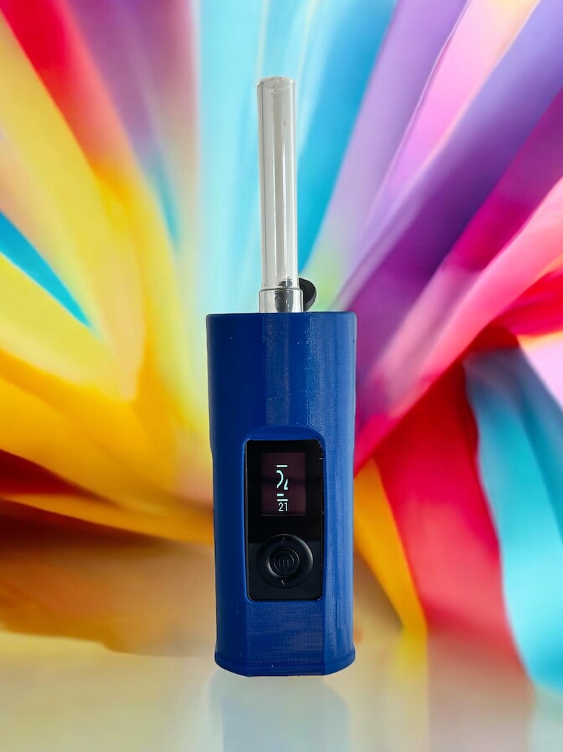 May include: A blue electronic vaporizer with a clear mouthpiece and a digital display showing the temperature set to 214 degrees Fahrenheit.