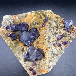 purple fluorite / on matrix / crystal mineral specimen