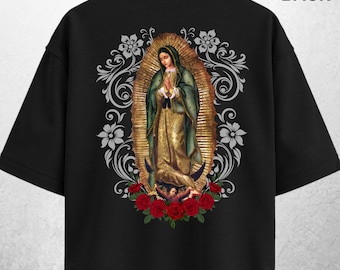 May include: Black t-shirt featuring a detailed graphic of a religious figure with a gold halo, green and gold robes, and red roses at the bottom. The word "BACK" is printed at the top, and "BLACK" at the bottom.