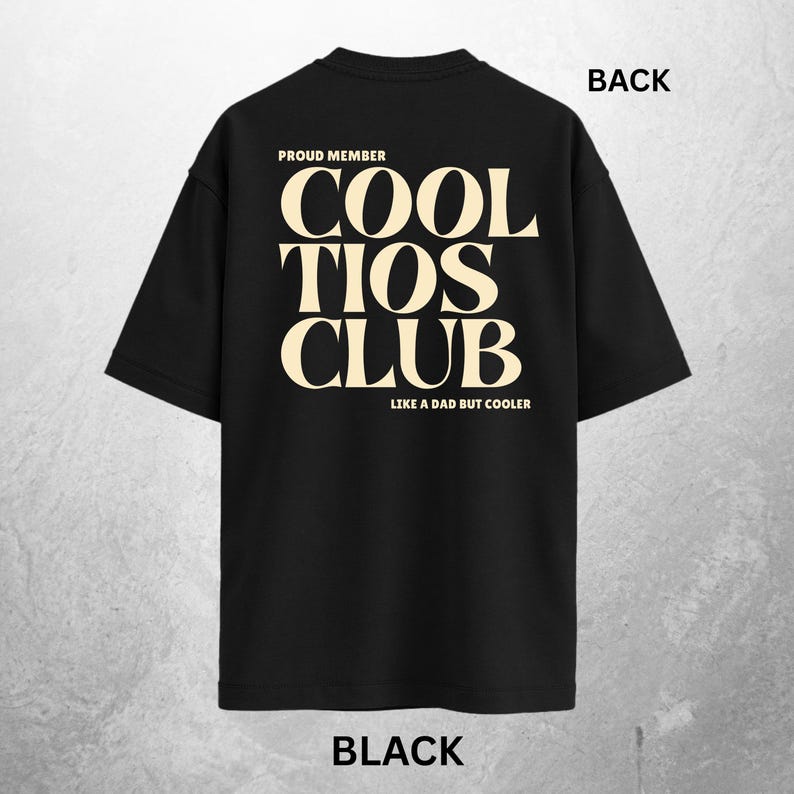 May include: Black t-shirt with the text "COOL TIOS CLUB" in a cream-colored font. The text "PROUD MEMBER" is above the main text, and "LIKE A DAD BUT COOLER" is below. The word "BACK" is printed at the top.