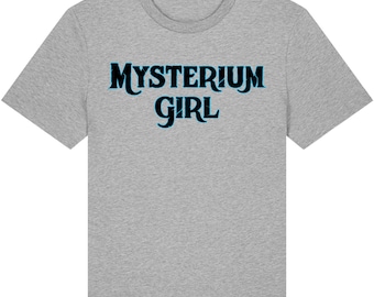 May include: Heather grey t-shirt with the text "MYSTERIUM GIRL" in a stylized font. The text is in a dark blue color with a light blue outline. The shirt is made of a soft material.