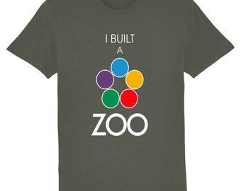 May include: A dark green t-shirt with the text "I built a zoo" in white. The text is centered on the shirt and is accompanied by a colorful logo of six circles arranged in a star shape.
